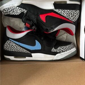 Jordan Legacy’s Nike Kids Black and Red Sneakers with Blue Swoosh
